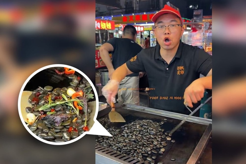 Đoạn clip anh chủ hàng ăn làm món 'đá xào' khiến CĐM xôn xao - Ảnh: SCMP