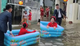 Đám cưới mùa mưa, chú rể lội nước rước dâu bằng phao bơi trẻ em nhưng vẫn ngập tràn hạnh phúc