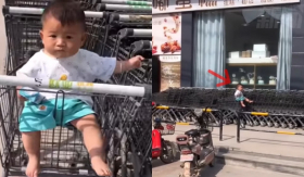 Bắt gặp em bé ngồi một mình trên xe đẩy hàng siêu thị dưới trời nắng CĐM thắc mắc mẹ bé đâu rồi?