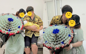 Netizen xúc động trước khoảnh khắc người chồng tặng vợ bầu bó hoa làm bằng tiền mừng vợ sinh nở thuận lợi