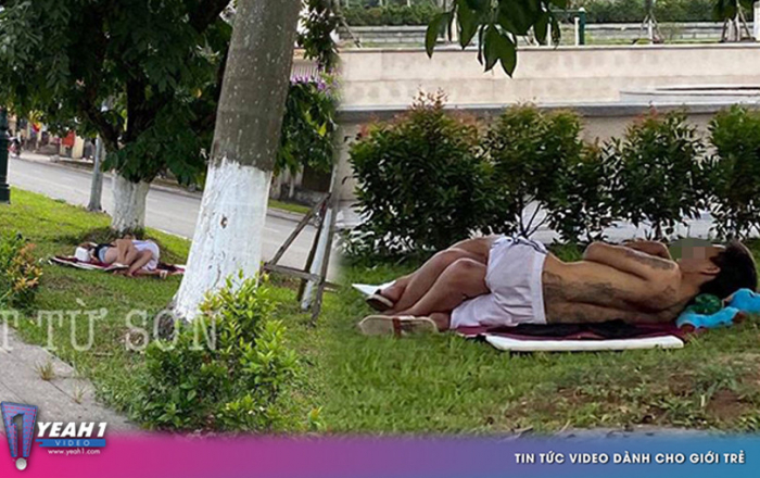 Phẫn nộ cặp đôi ăn mặc mát mẻ, vô tư nằm hôn hít trên bãi cỏ ven đường