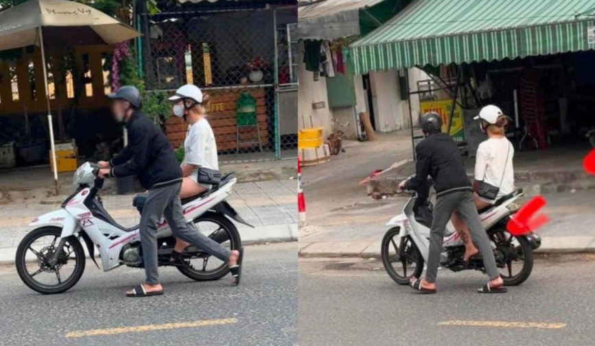 Cô gái ngồi chễm chệ trên xe máy hỏng, mặc bạn trai hùng hục dắt giữa nắng hè gần 40 độ?