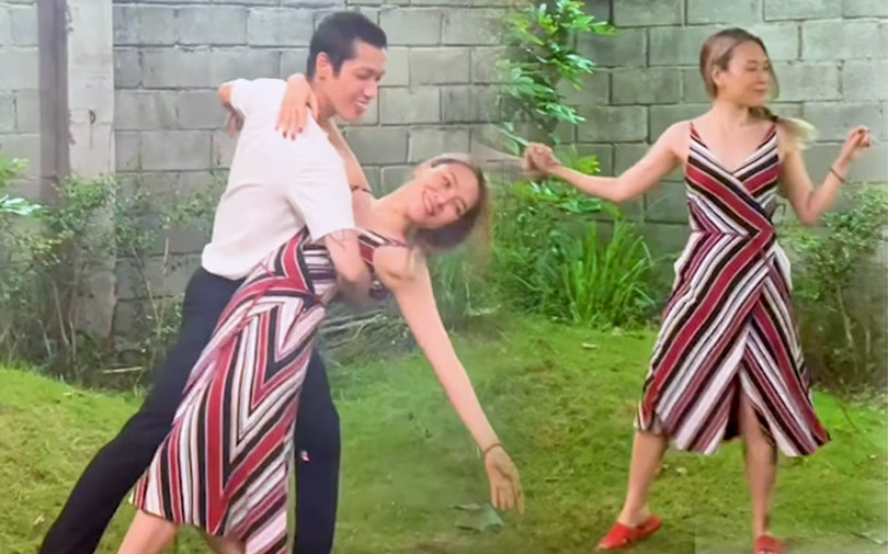 Mỹ Tâm khiêu vũ cực lãng mạn cùng trai lạ trong vườn nhà, fan cười xỉu khi nhìn đôi dép nữ ca sĩ mang